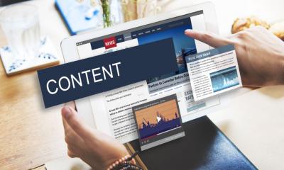 A man is copying web content from another business' website