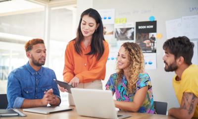 A small team are refining their email marketing campaigns