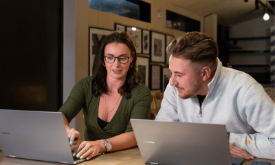 A couple are working on the latest laptops