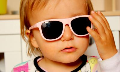 Young child wearing sunglasses