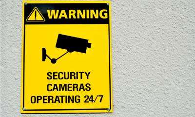 A yellow CCTV in operation sign